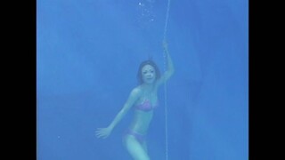 beautiful japanese girl underwater swimming